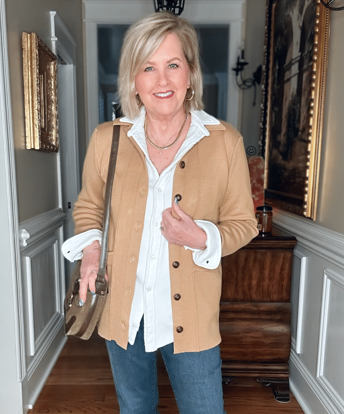 Tania Stephens is wearing a casual knit cardigan blazer with a white shirt and jeans